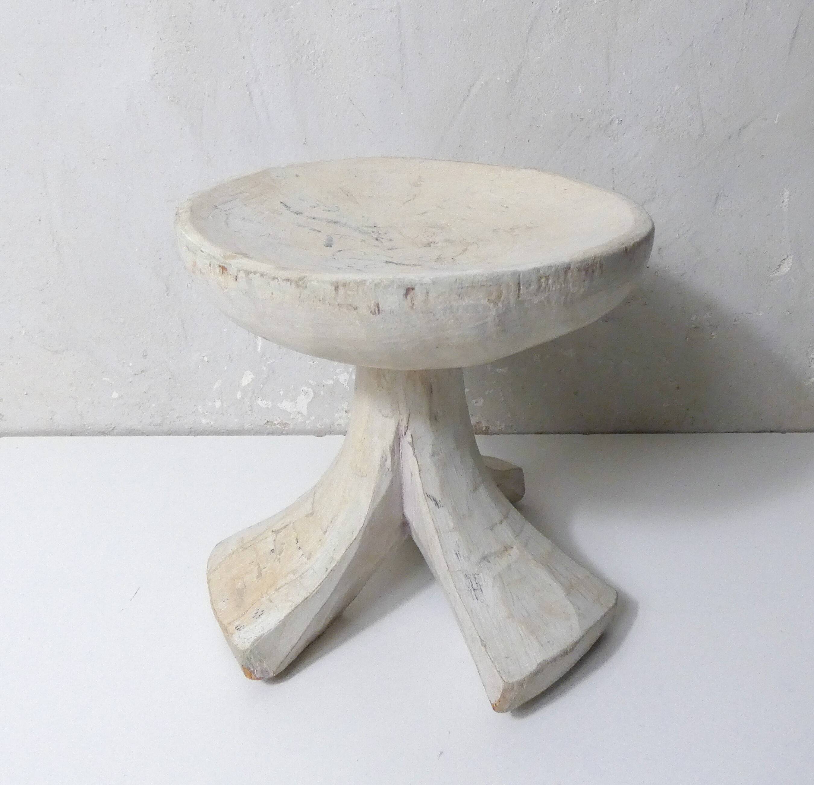 antique small tripod bench/stool in solid carved brutalist wood