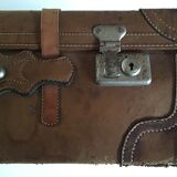 suitcase of leather with labels of palaces