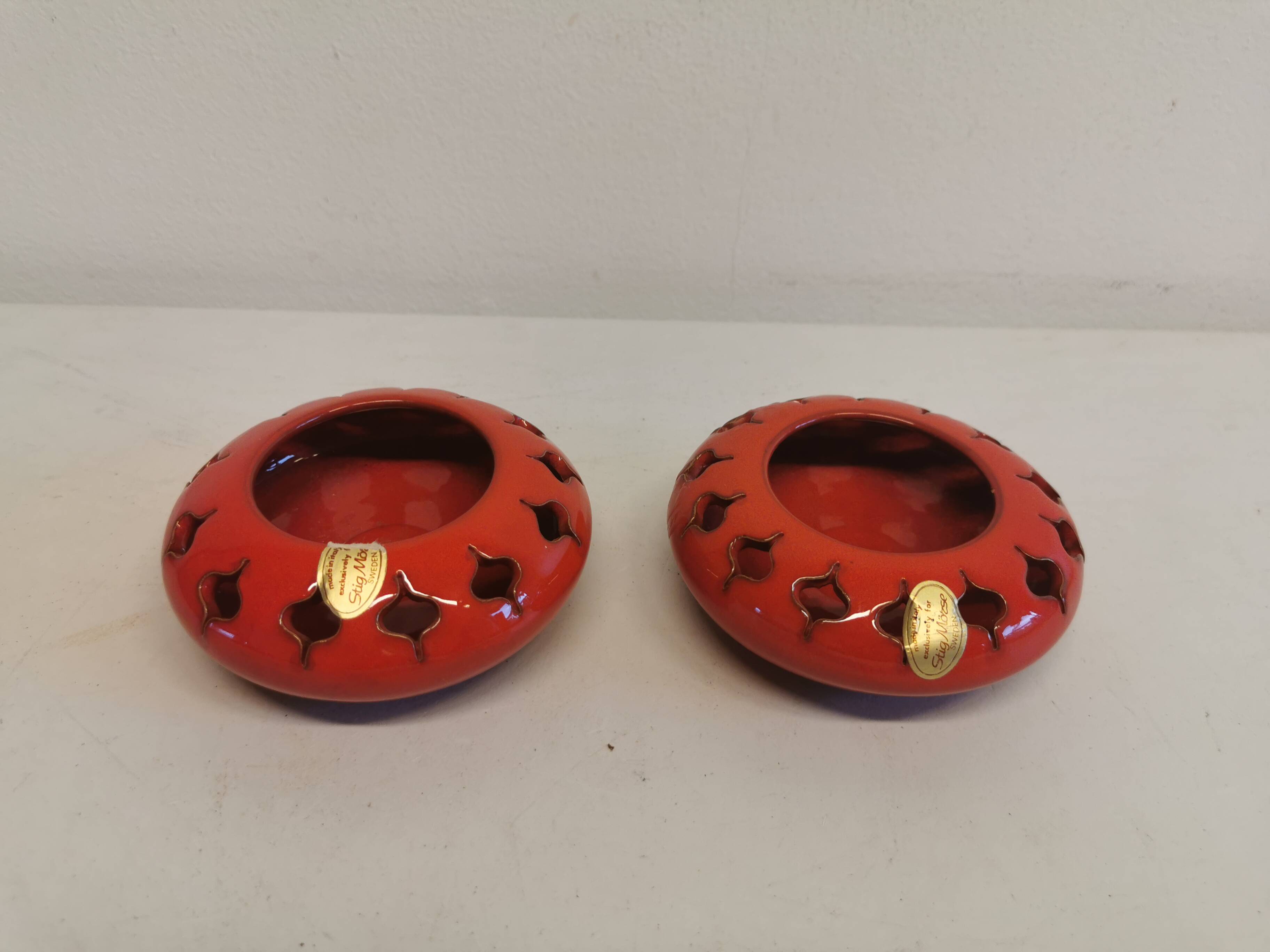 Pair of candle holders from the 1960s-1970s, crafted in red ceramic