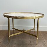 Neoclassical style round coffee table in brass with a white Carrara marble top from Jansen