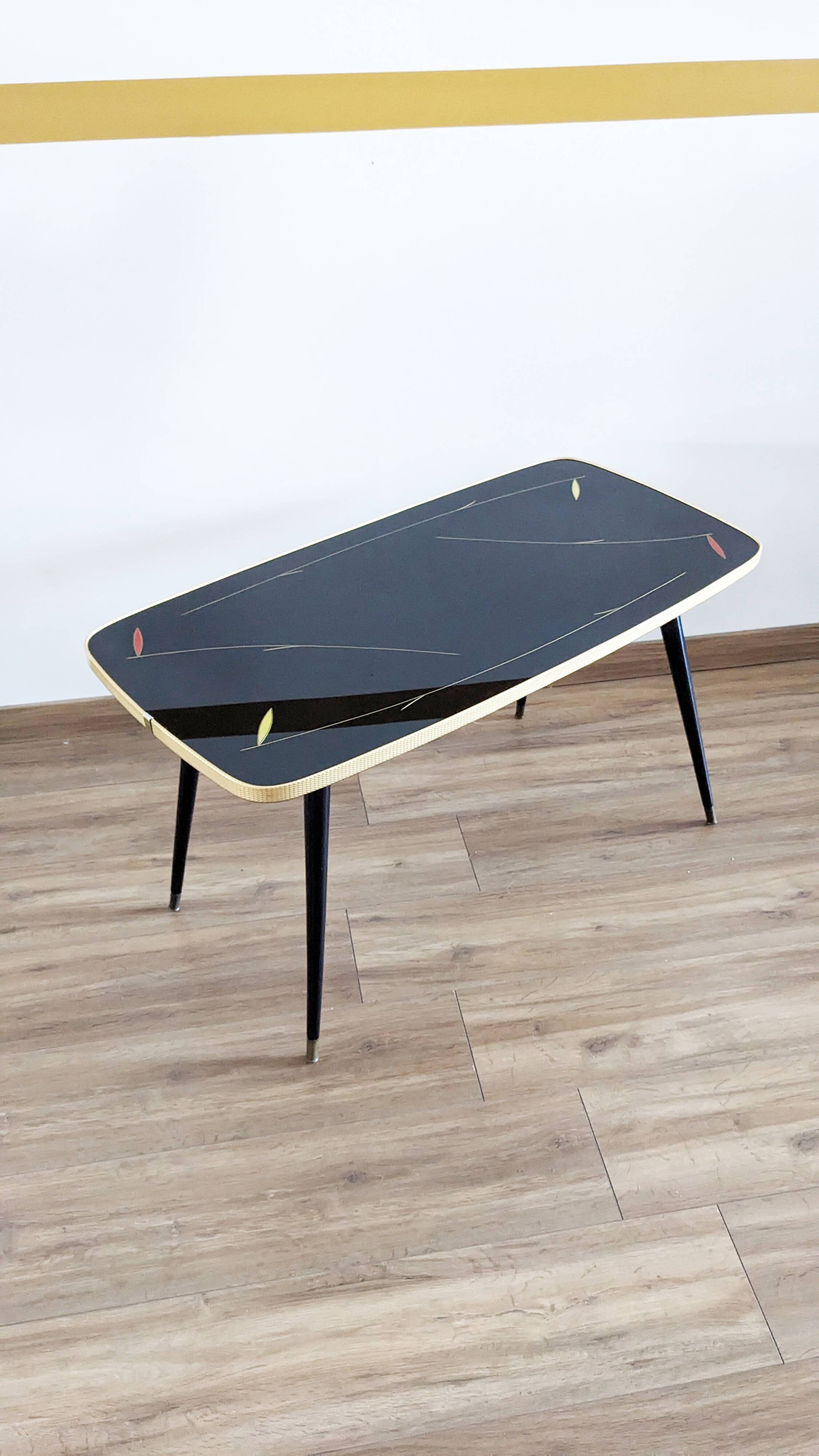 Glass coffee table with spindle legs