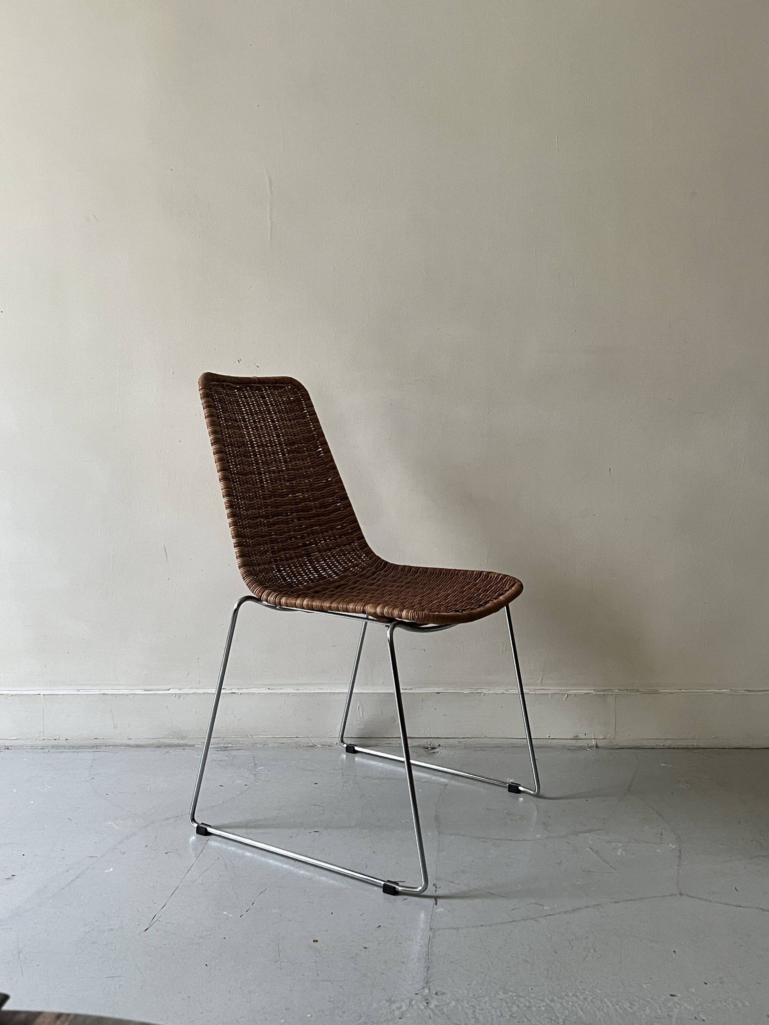 Chair made of rattan, wicker and chrome-plated metal