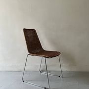 Chair made of rattan, wicker and chrome-plated metal
