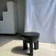 Black mango wood tripod side table with a semi-spherical top, height: 45 cm, diameter: 44 cm.