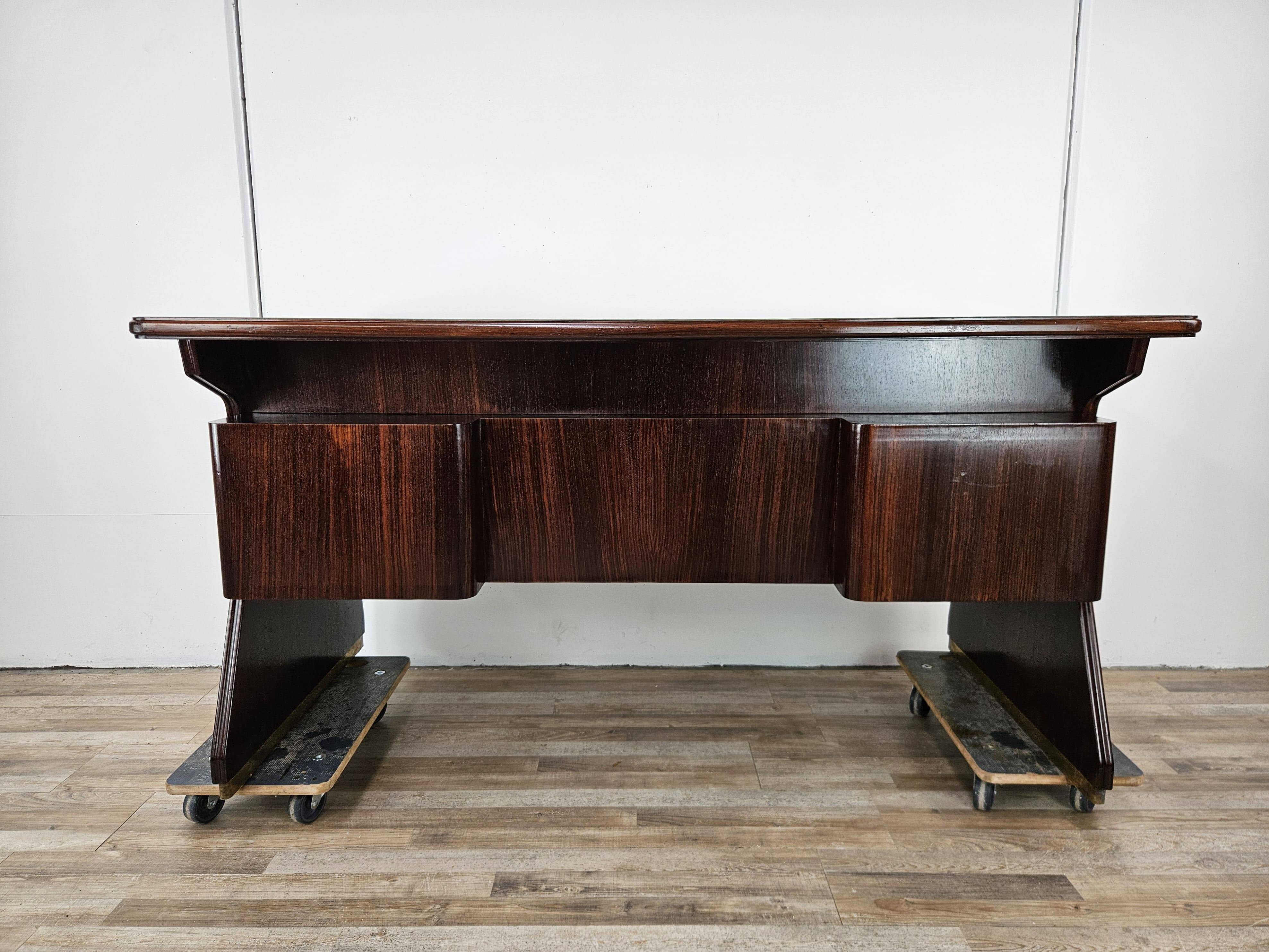 Executive Art Decò desk in exotic wood, glass, and brass