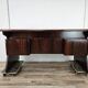 Art Deco executive desk in exotic wood, glass, and brass.