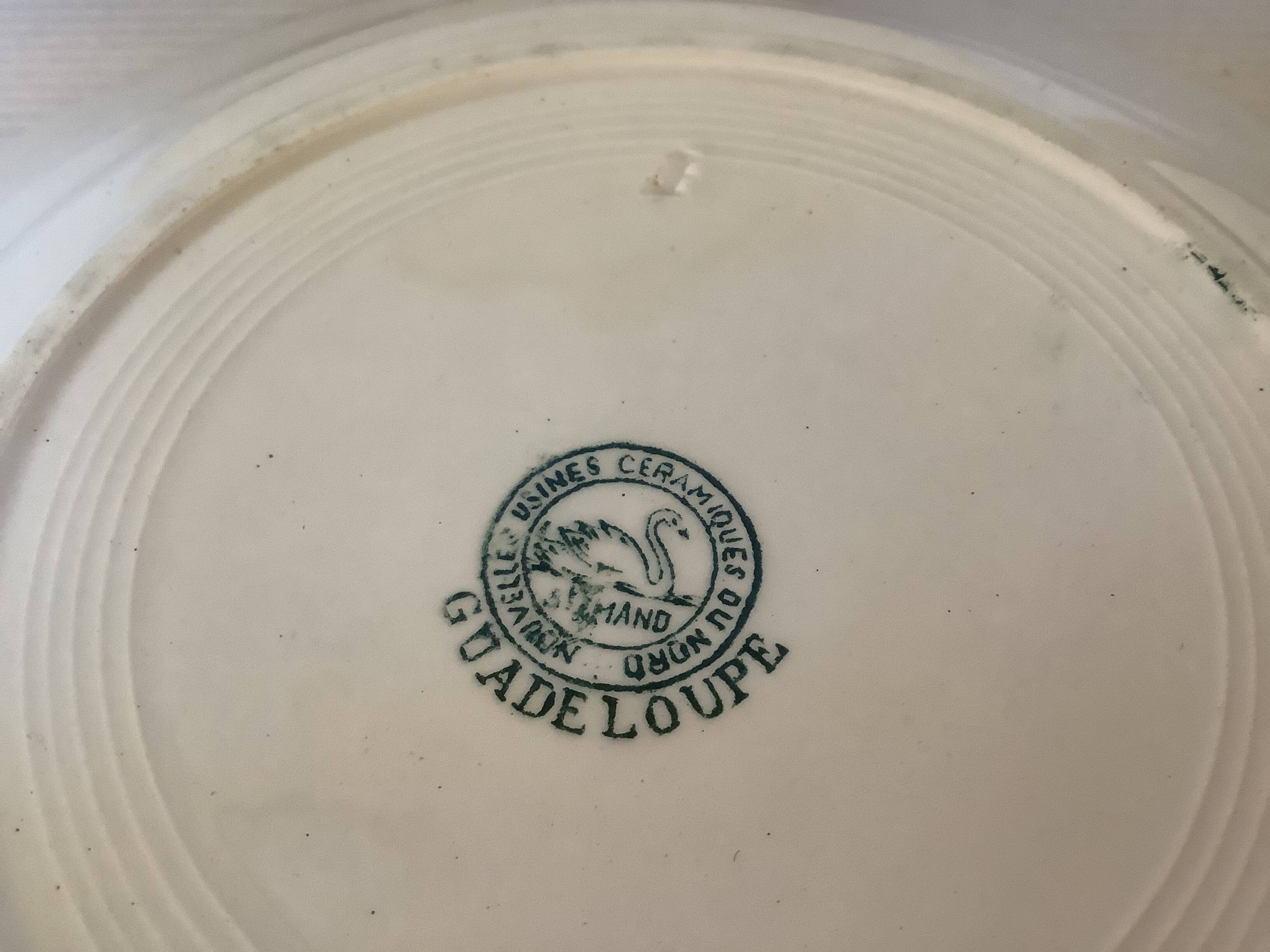 Four old earthenware plates