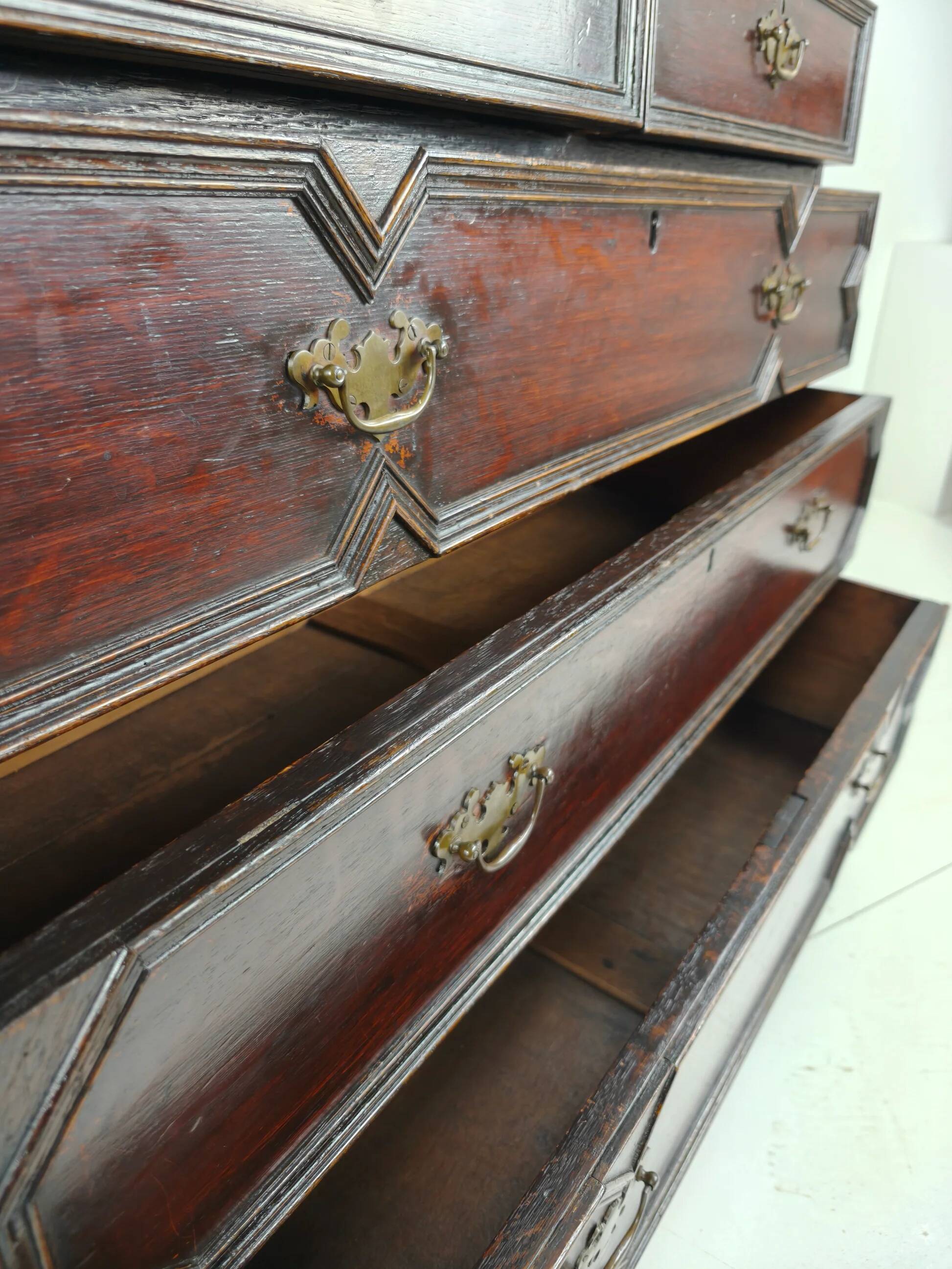 English geometric-panelled oak chest of drawers, circa 1680