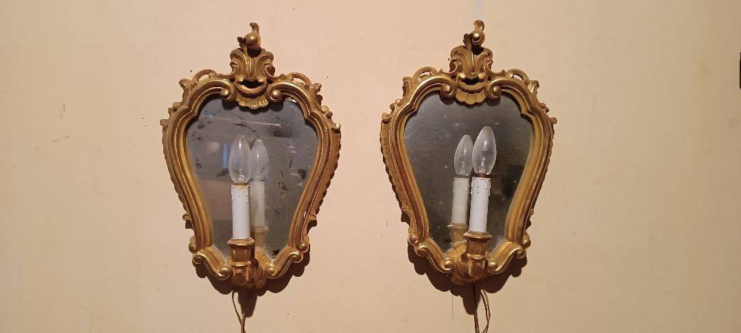 Vintage gold mirror sconces from the late 1950s.