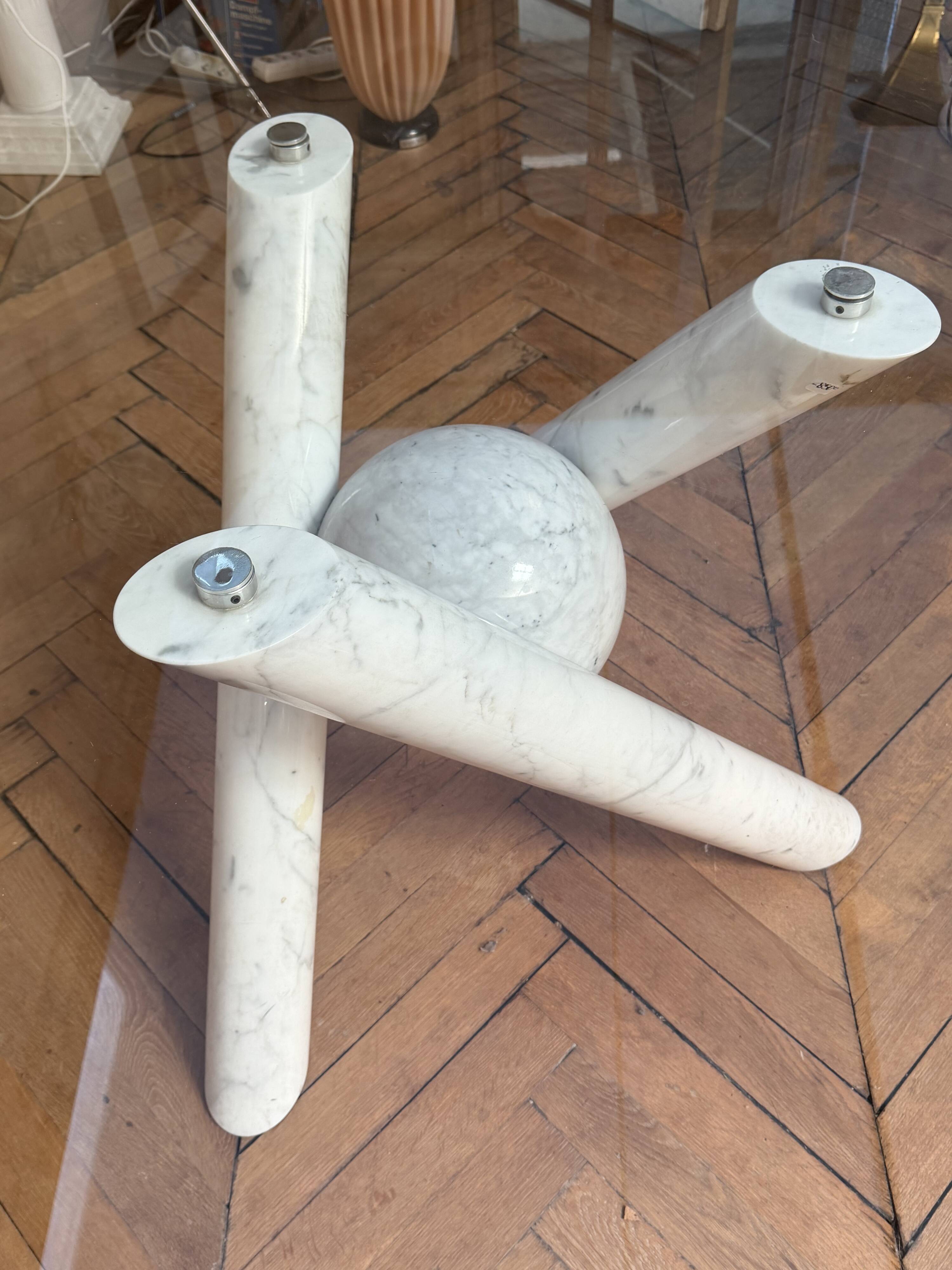 Dining table with glass top and marble base, Ligne Roset.