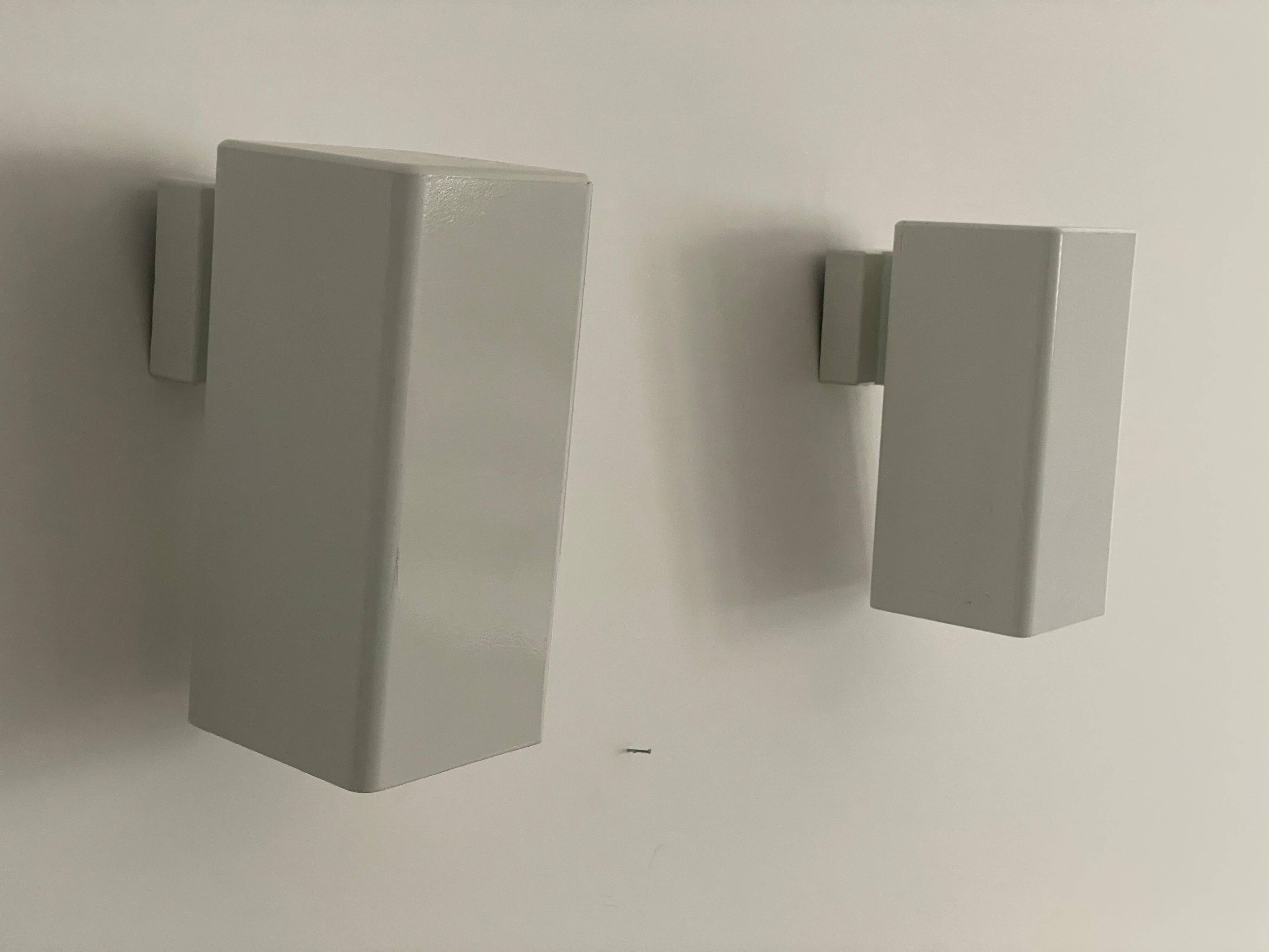 Pair of minimalist white metal wall lights from the mid-century, 1960, Germany.