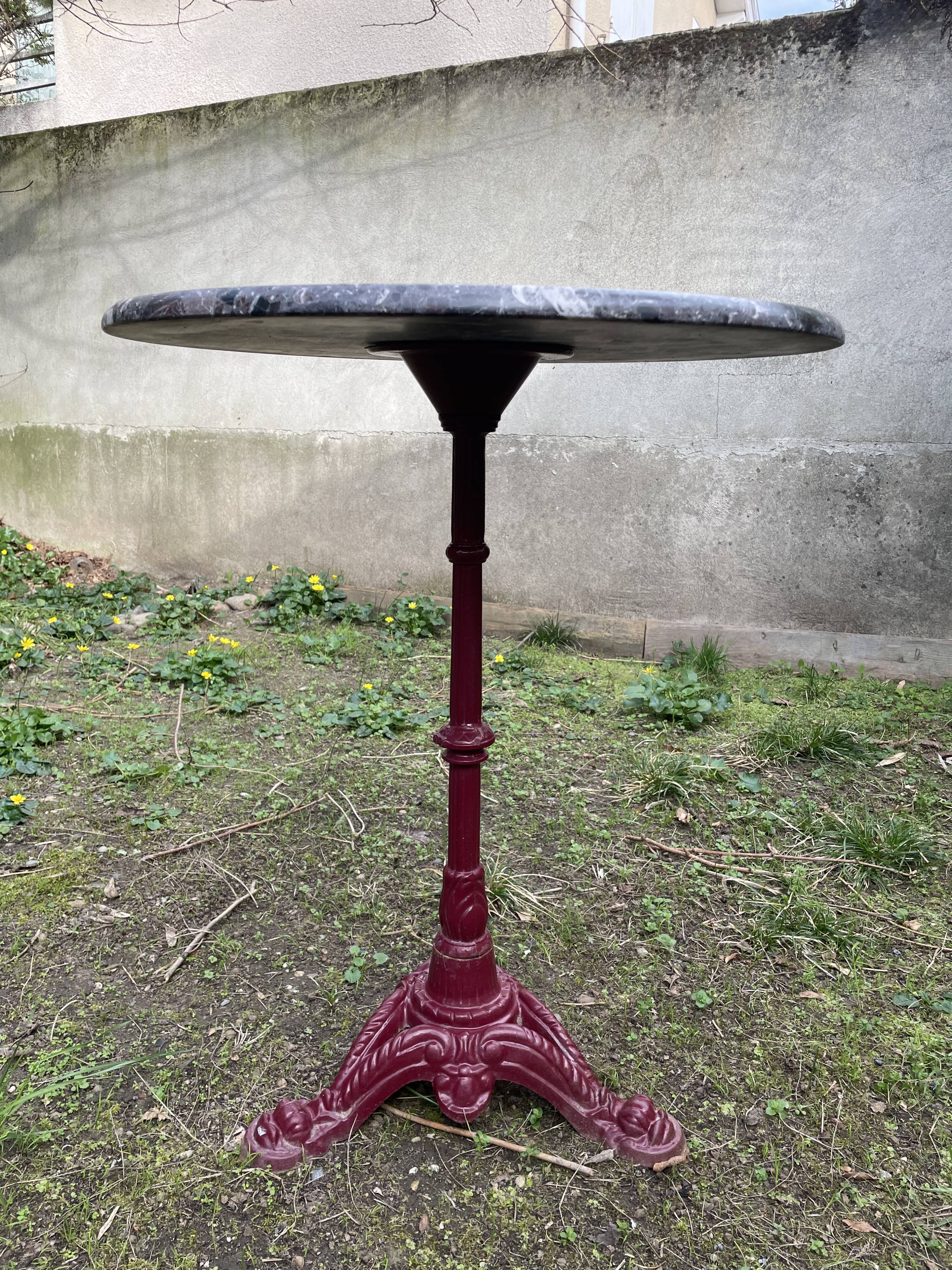 Bistro table with cast iron and marble legs