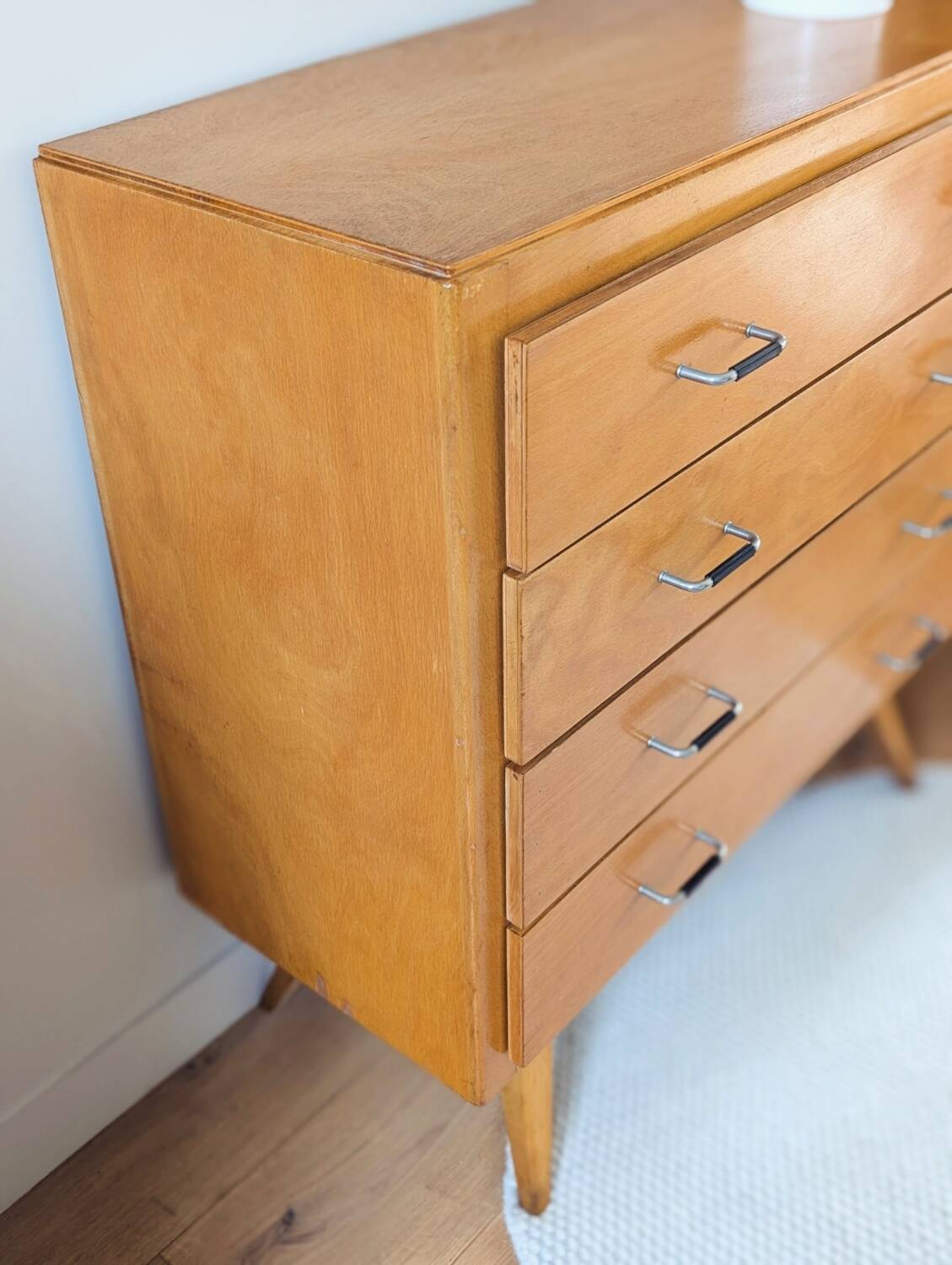 Vintage chest of drawers with tapered legs from the 1960s.
