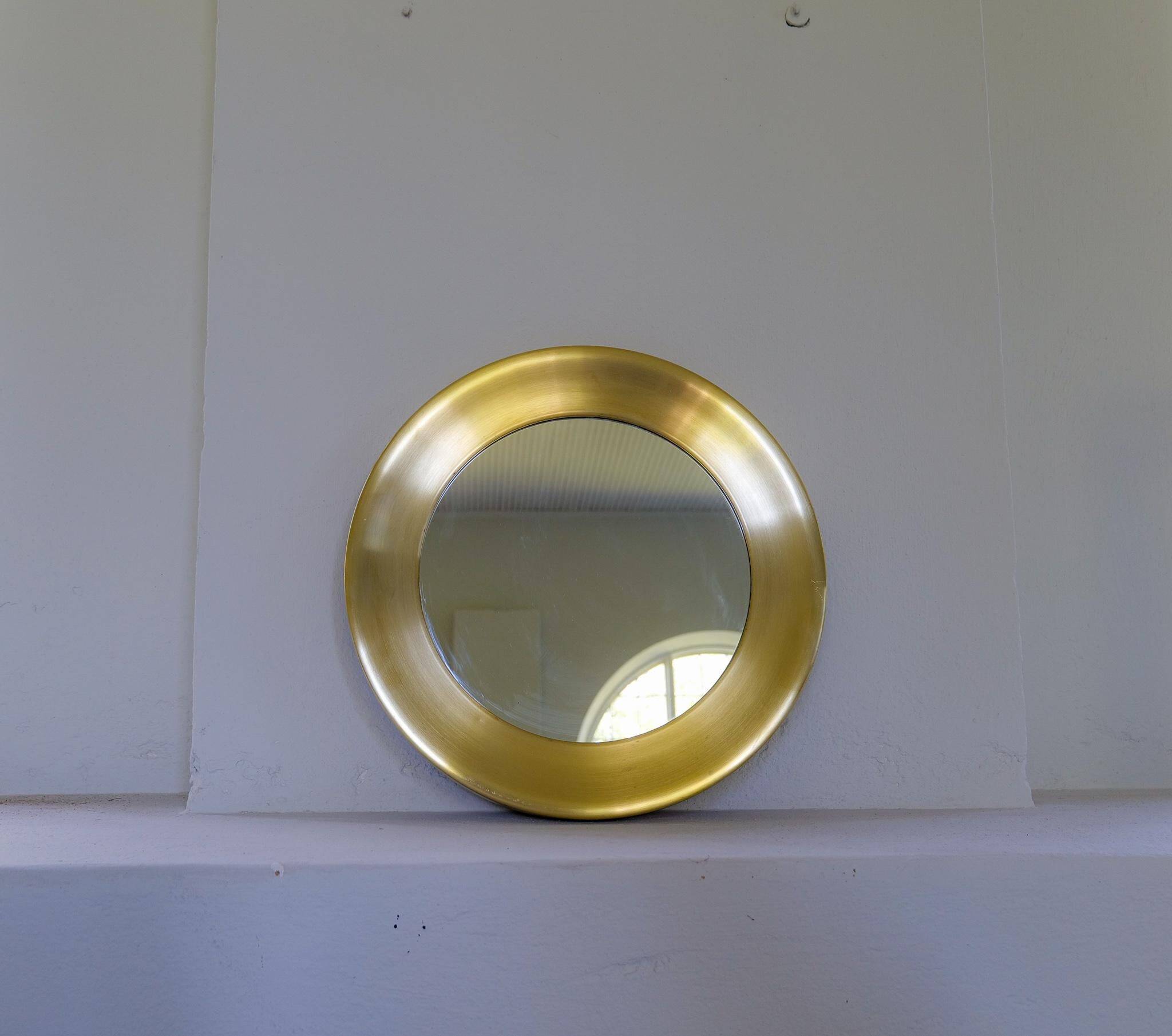 Modern round brass mirror from the mid-century by Glasmäster in Markaryd, Sweden, 1960s.