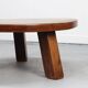 Large vintage round coffee table in raw oak brutalism.