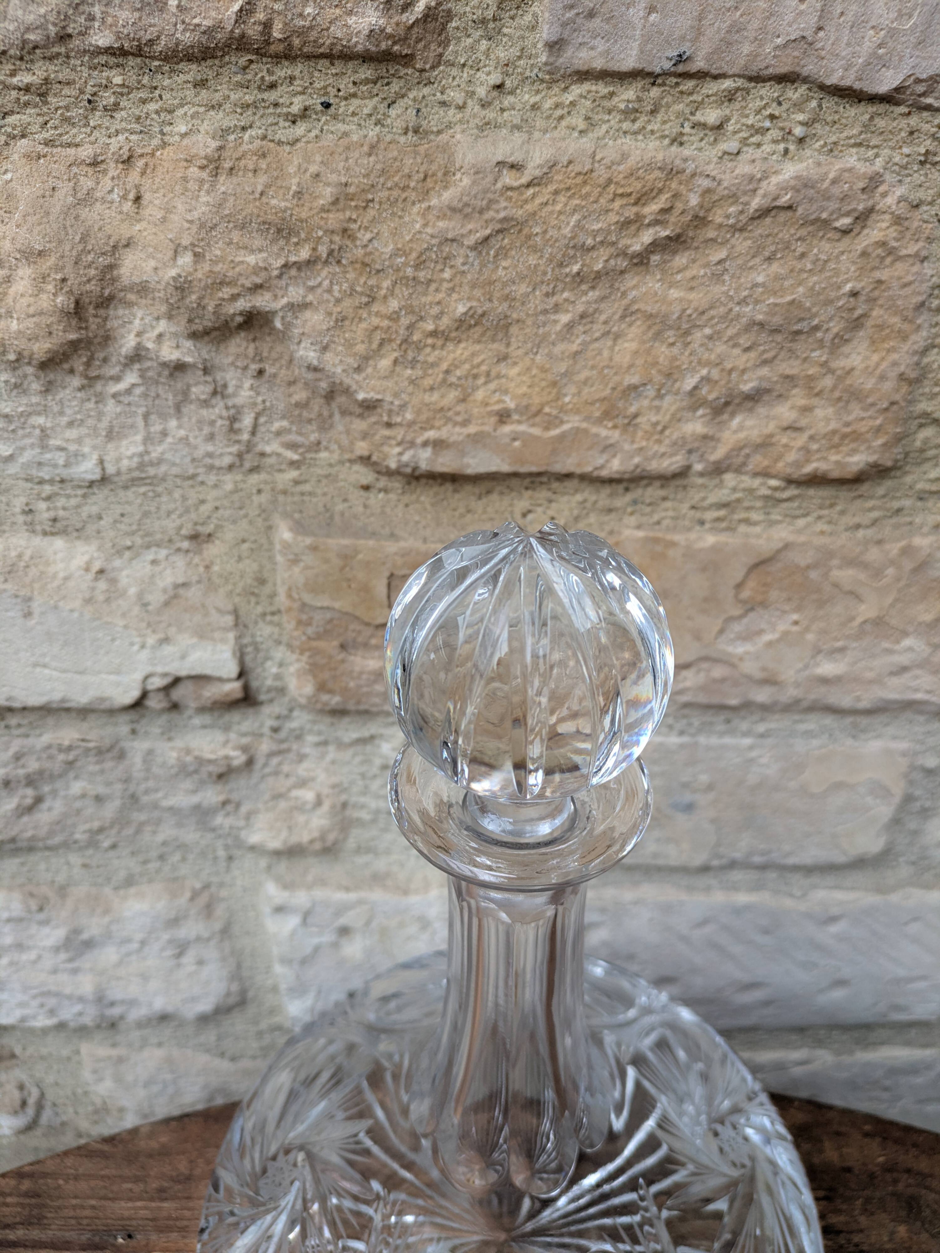 Antique cut crystal decanter with stopper.