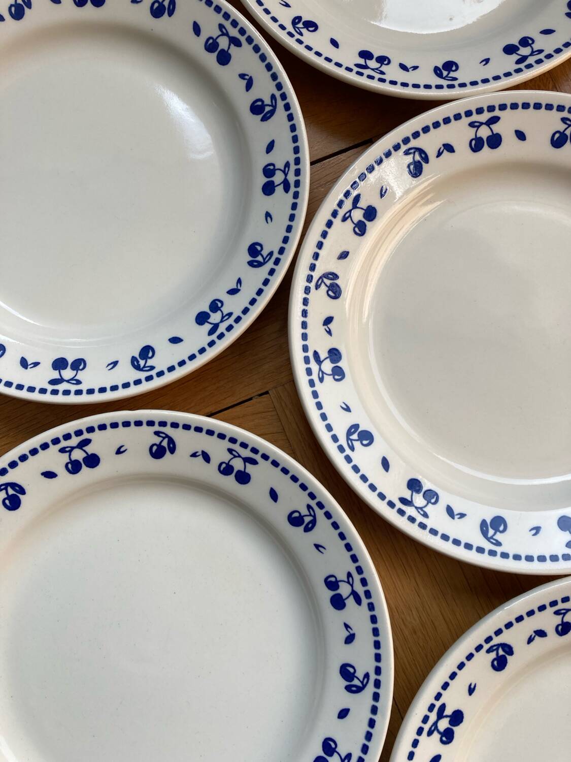 Vintage dessert plates with blue cherry pattern