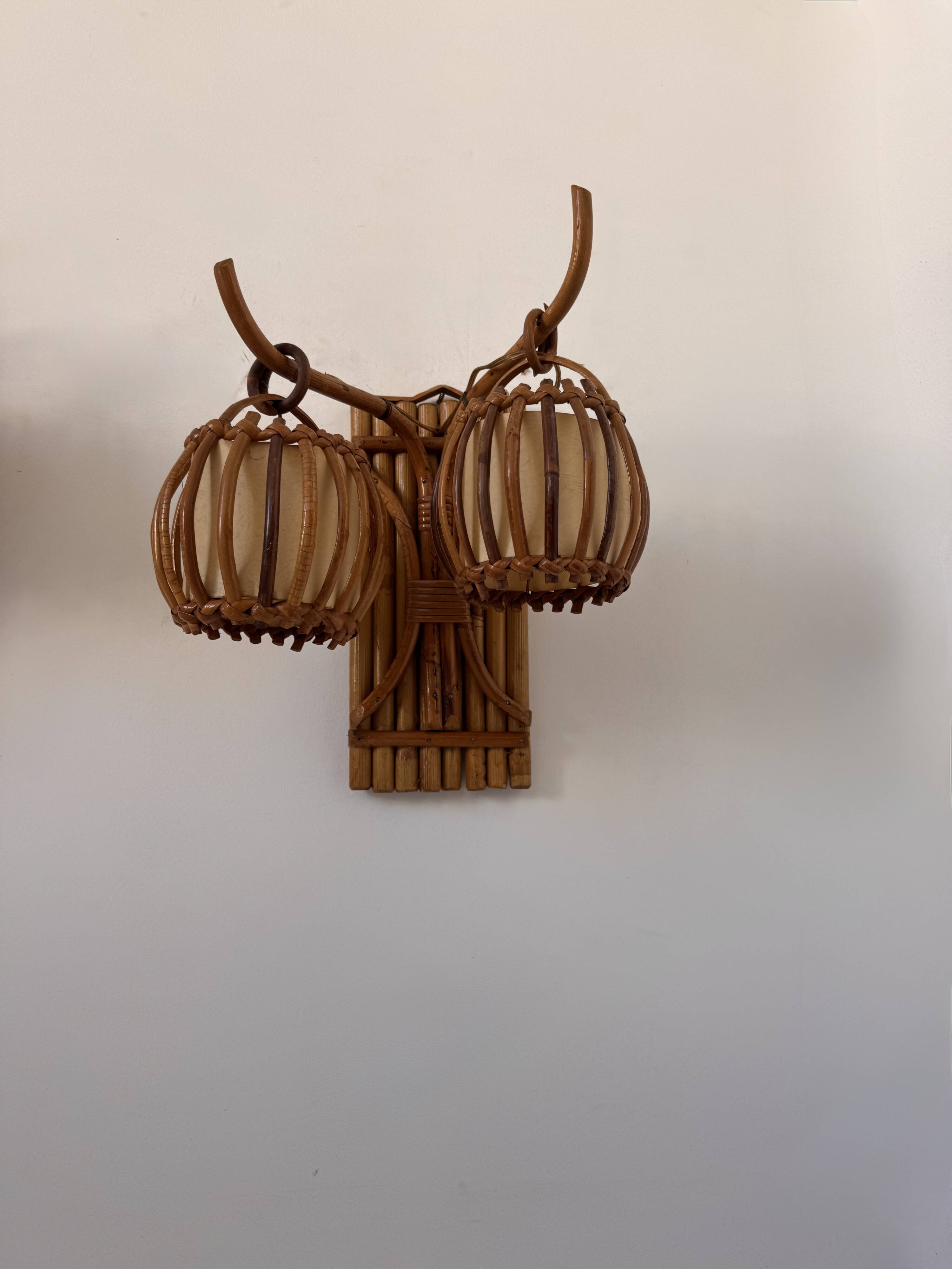 Vintage pair of rattan wall lights, France, 1950.