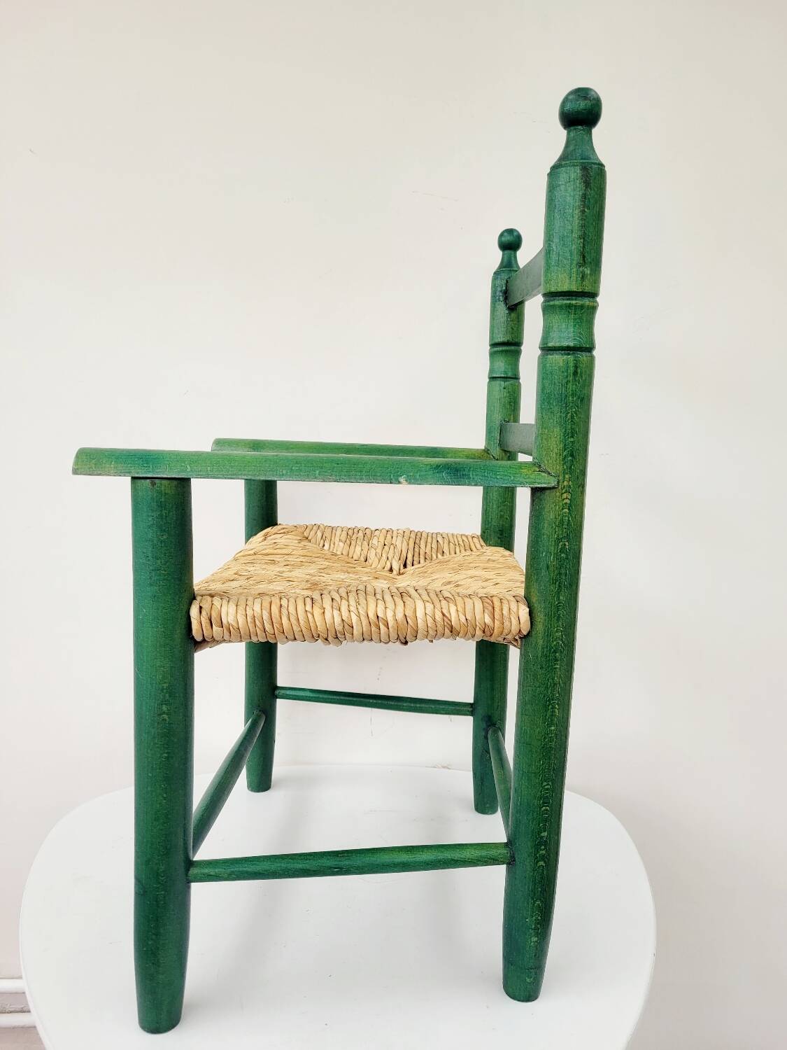 Small vintage children's chair in wood and green straw