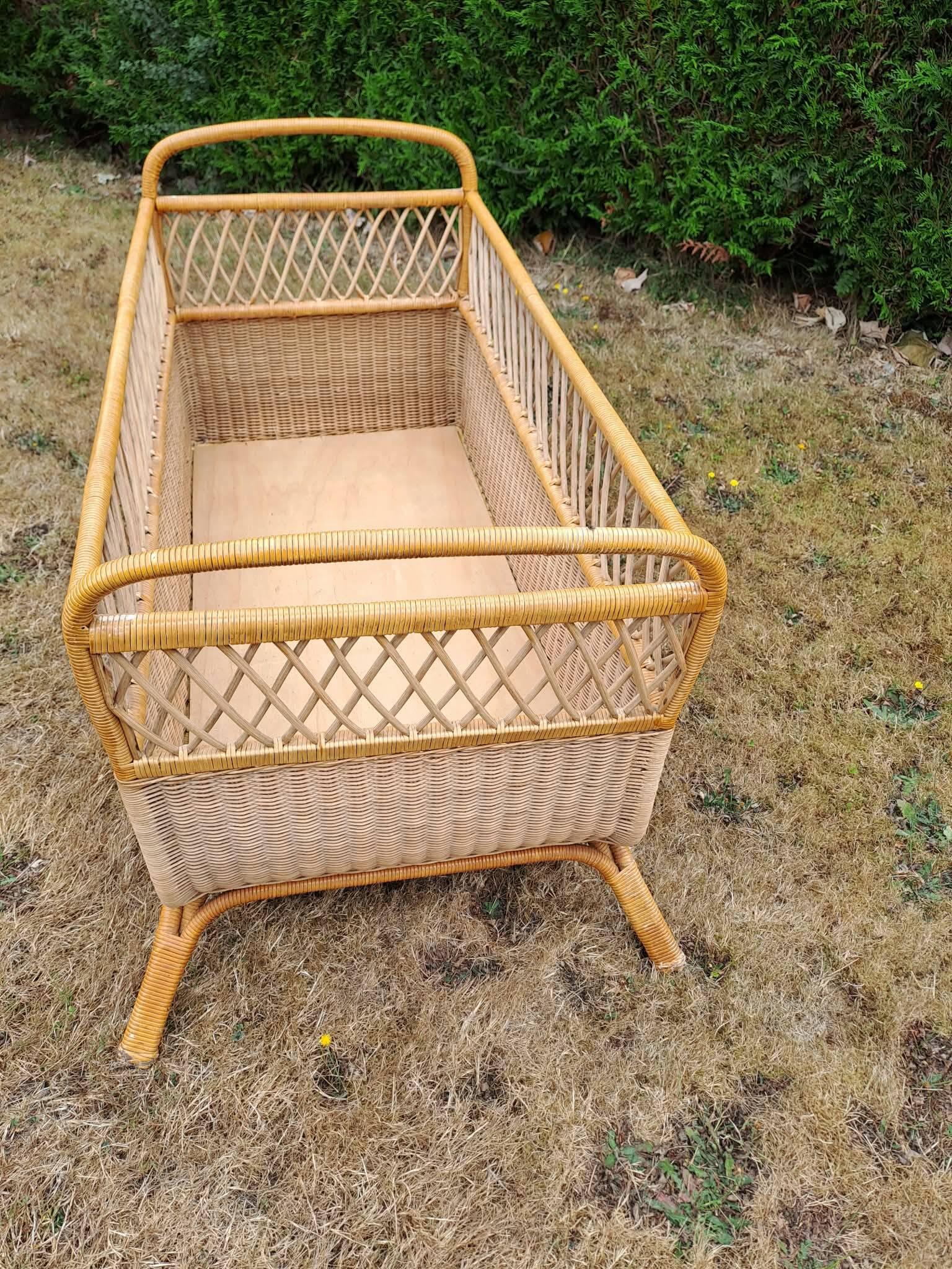 Rattan cradle.