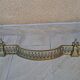 Louis XVI style bronze andirons and fireplace bar