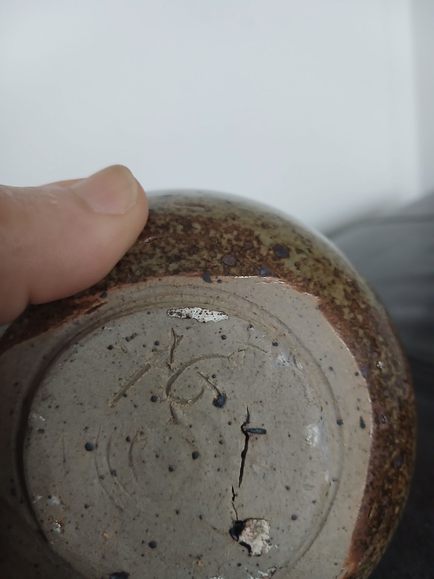 Wall-mounted round vase (flower holder) with the signature AG (Anne Marie Gassin).