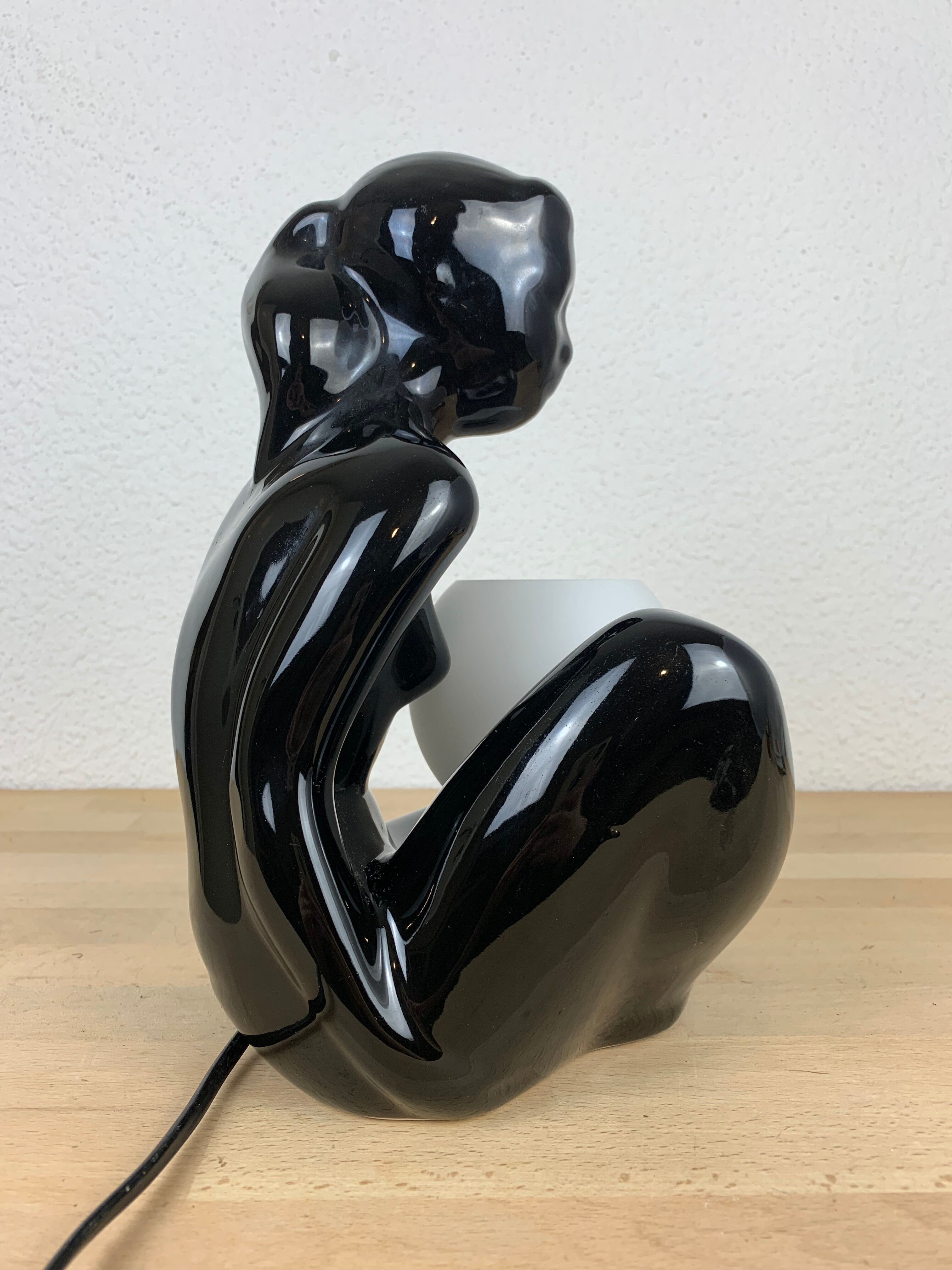 Black ceramic lamp and opal globe