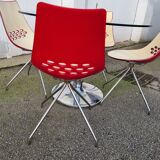 Guzzini dining set, round glass table and 4 shell chairs.