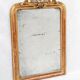 19th-century Louis-Philippe mirror with patina and pediment.