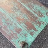 Pair of green teak coffee tables.