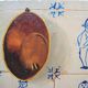 Old oil painting: still life with Dutch tiles