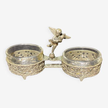 Spice centerpiece and serving spoon topped with a brass cherub