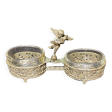 Spice centerpiece and serving spoon topped with a brass cherub