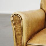 Unique children’s armchair made of cowhide leather in Art Deco style, featuring a light cognac color