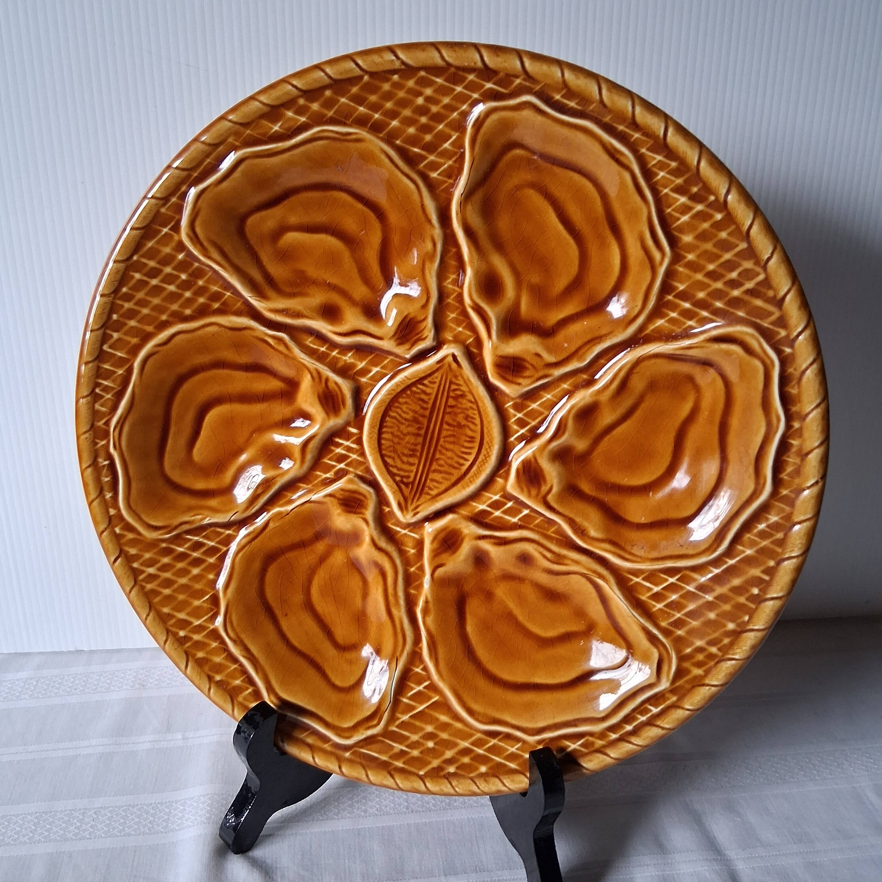 5 oyster or brown shell plates in good condition