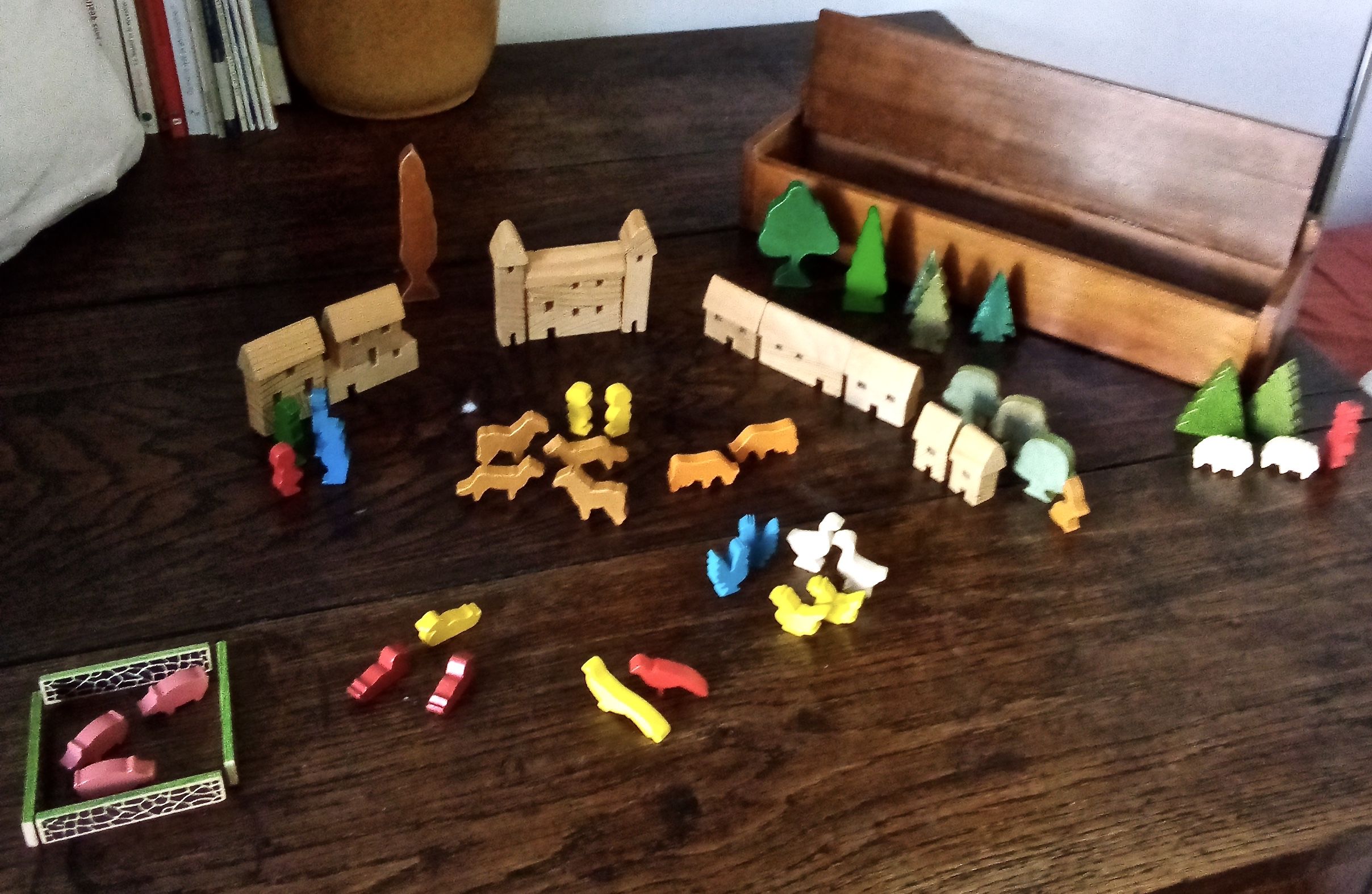 Village small farm wood painted with animals and characters stored in a large old box.