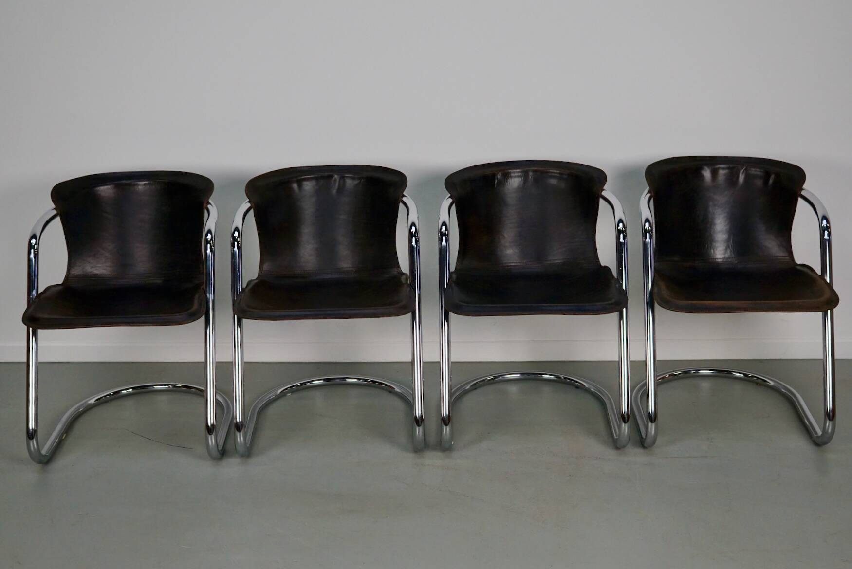 Set of four brown leather dining chairs, Willy Rizzo, 1970