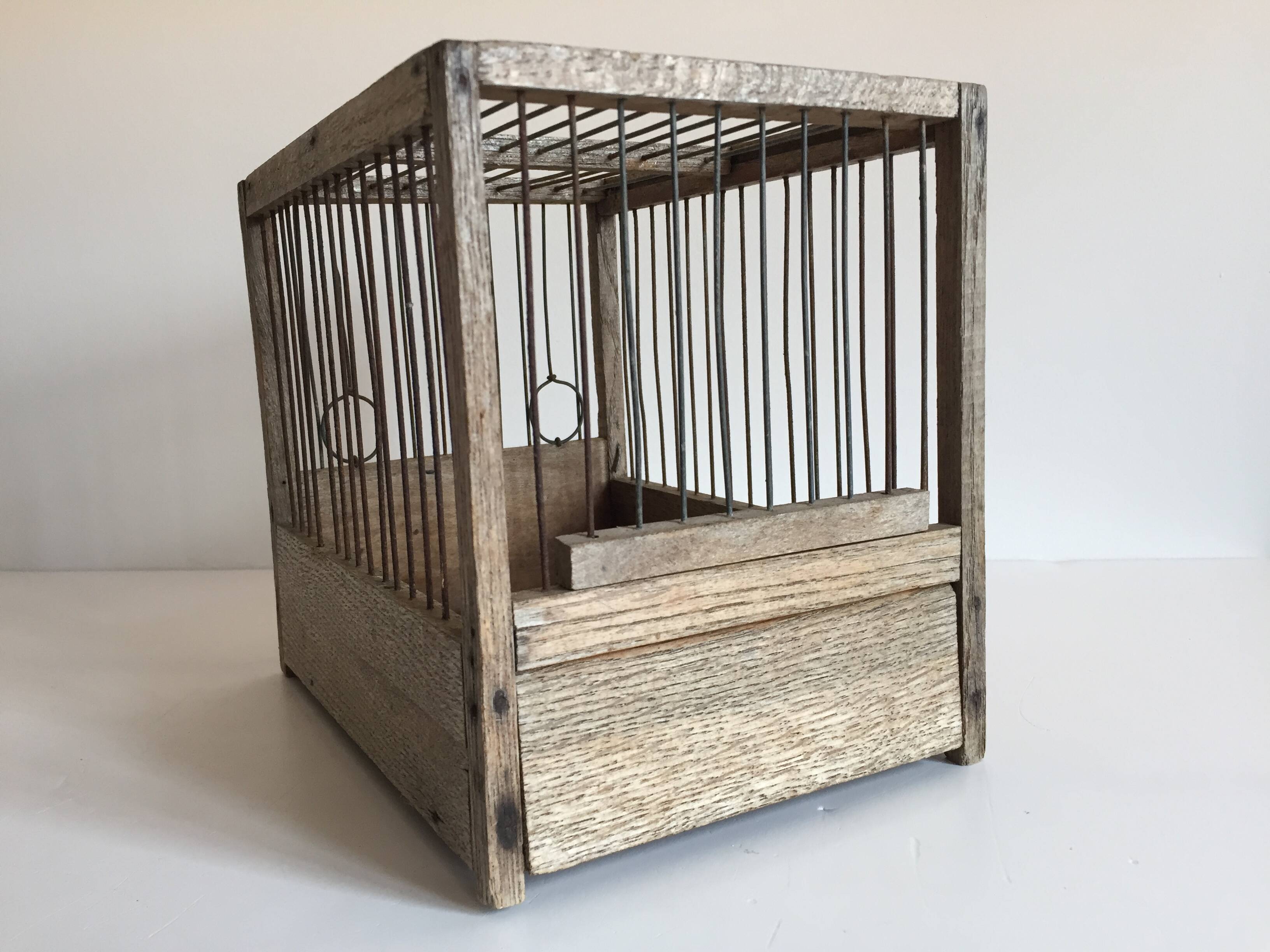 Old bird cage in wood and steel