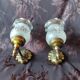 Pair of wall sconces in bronze with opaline glass tulips.