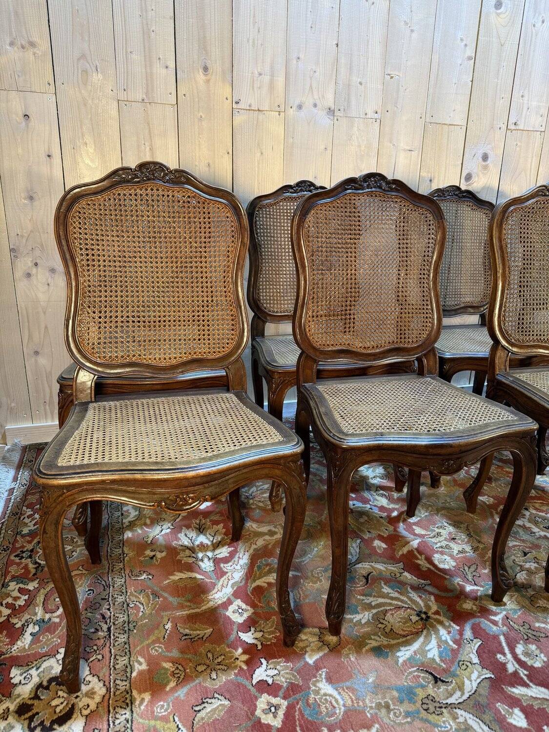 Set of 10 Louis XV style chairs in walnut and cane.