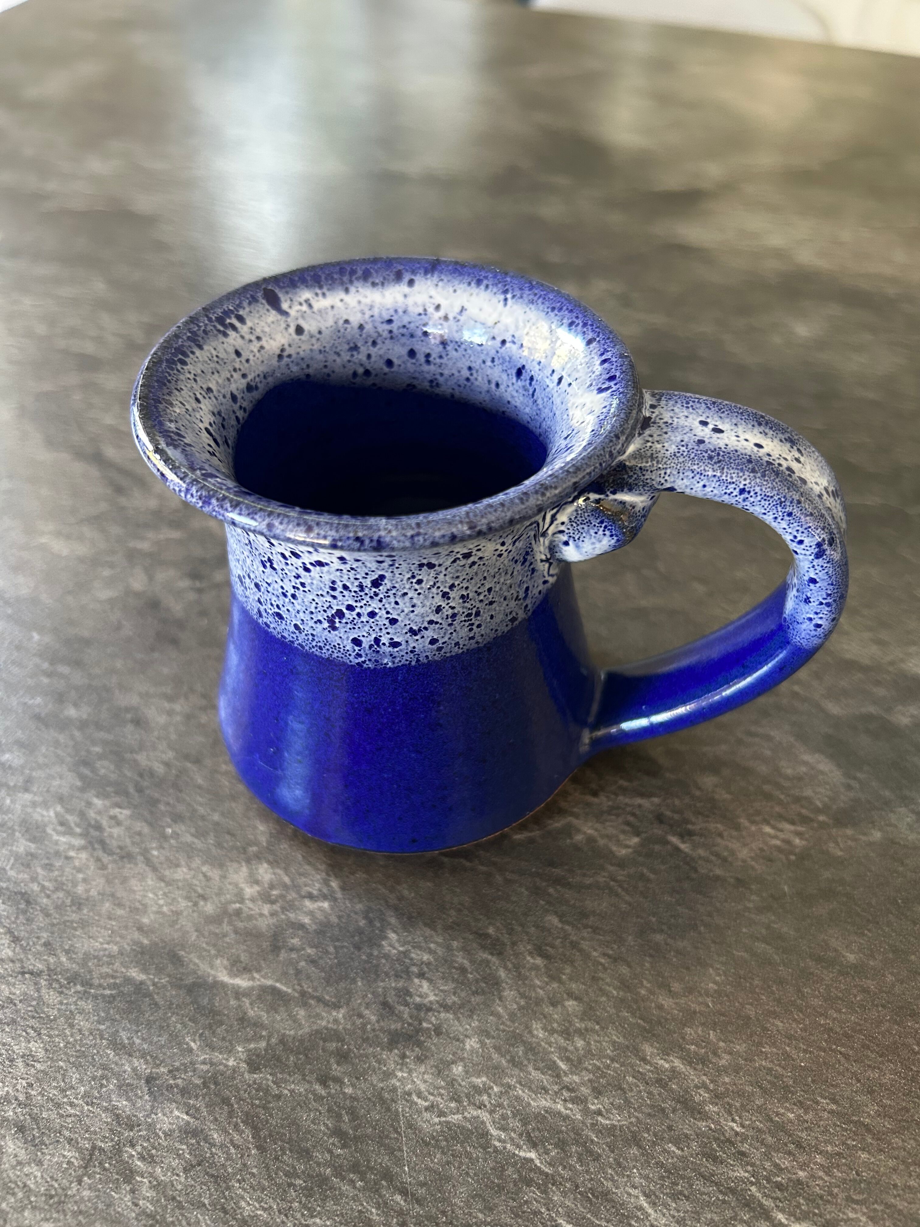 Small enamelled earthenware milk jug