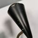 A set of wall lamps in black lacquered metal with brass details