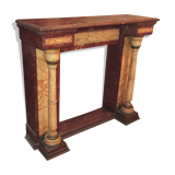 19th century wooden fireplace, faux marble paint. Can act as a console.