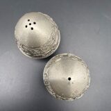 Egg-shaped metal salt and pepper shakers with Asian countryside motif