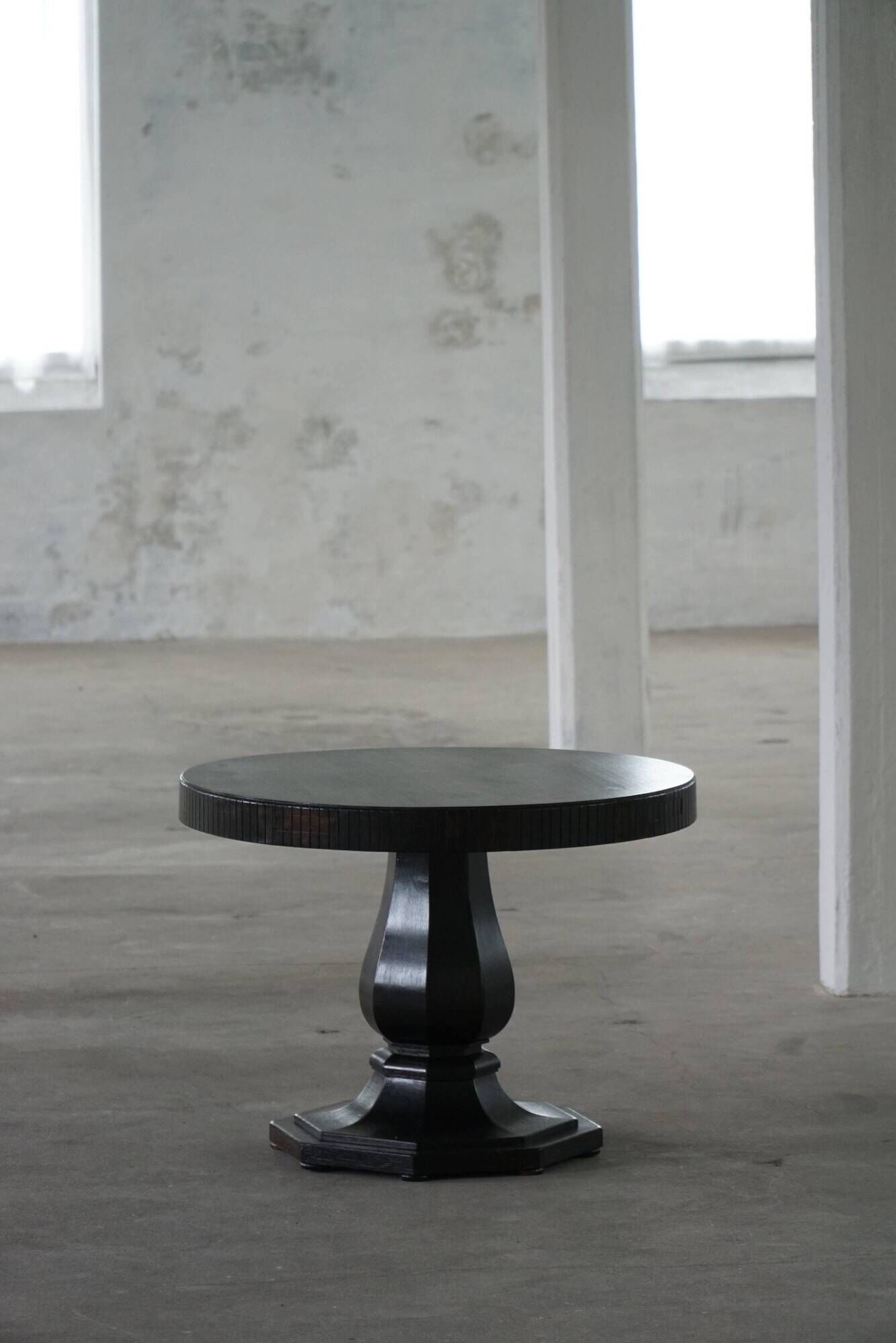 Dining table / round console in Danish Art Deco style in blackened oak, early 20th century.