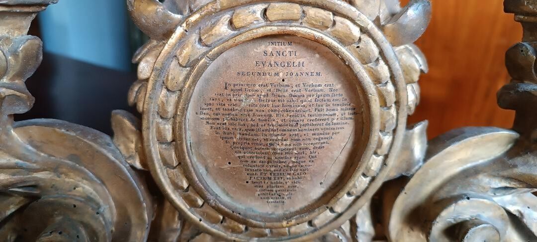 Ancient altar candlestick with gilded wooden cartagloria, 18th century.