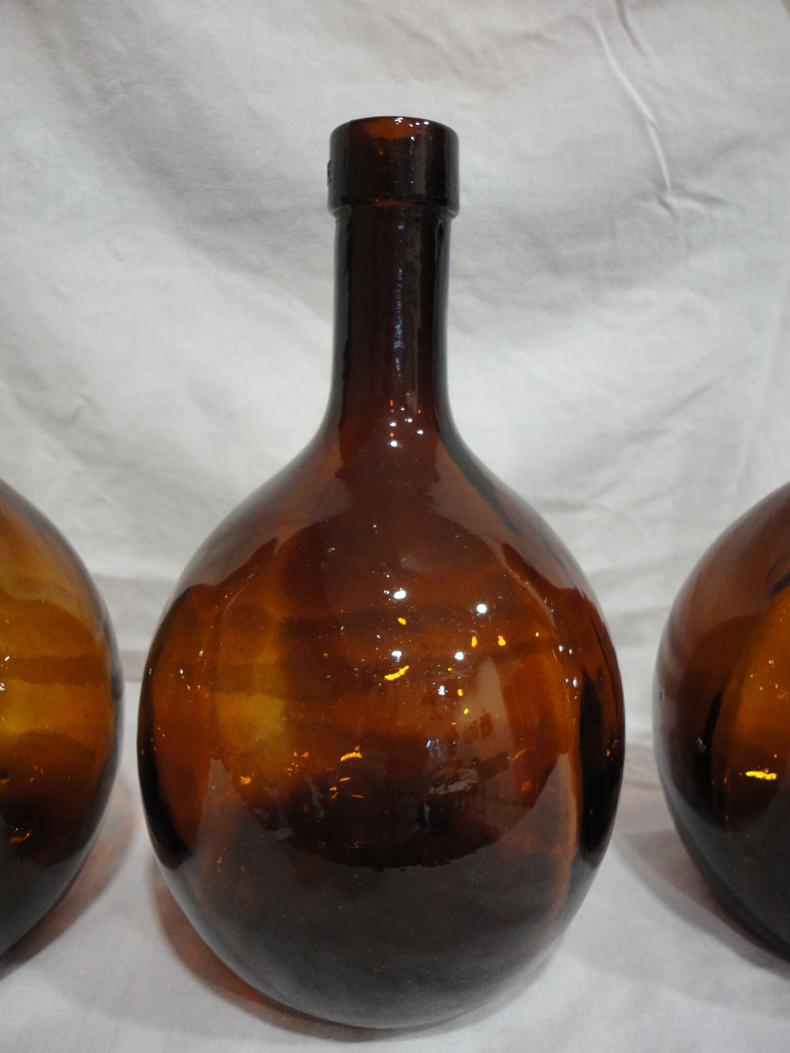 Lot 3 old round bottles