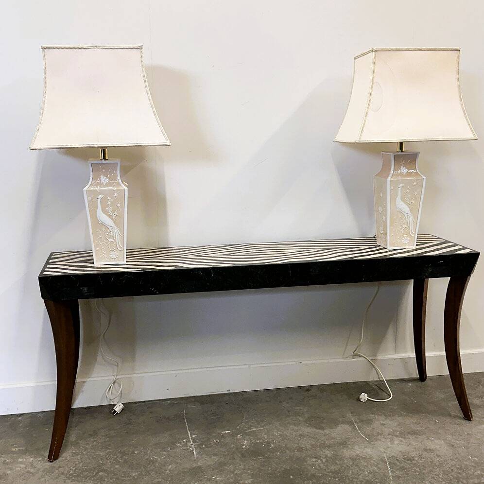 Pair of large cream ceramic table lamps with relief peacocks and fabric shades