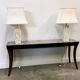 Pair of large cream ceramic table lamps with relief peacocks and fabric shades