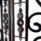 Black wrought iron screen, openwork floral pattern, 3 panels.